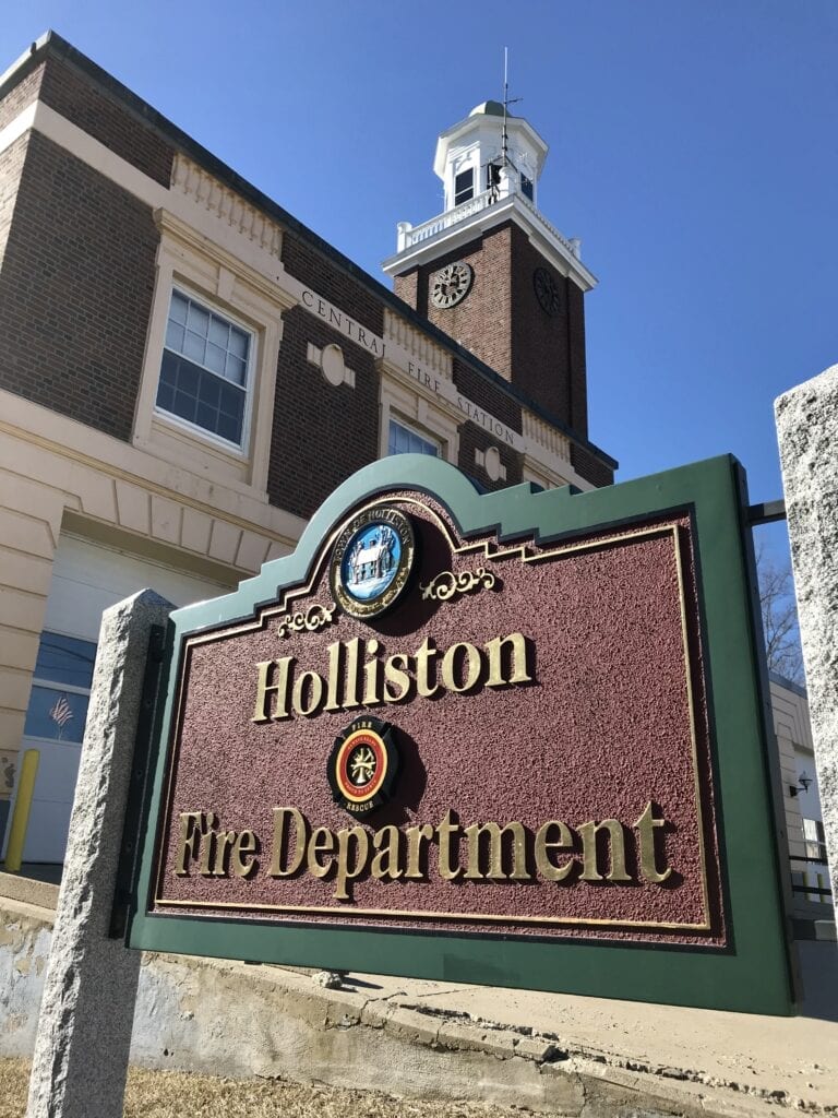 A Holliston Fire Department signage in front of a building  