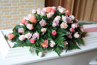 Flowers atop a casket